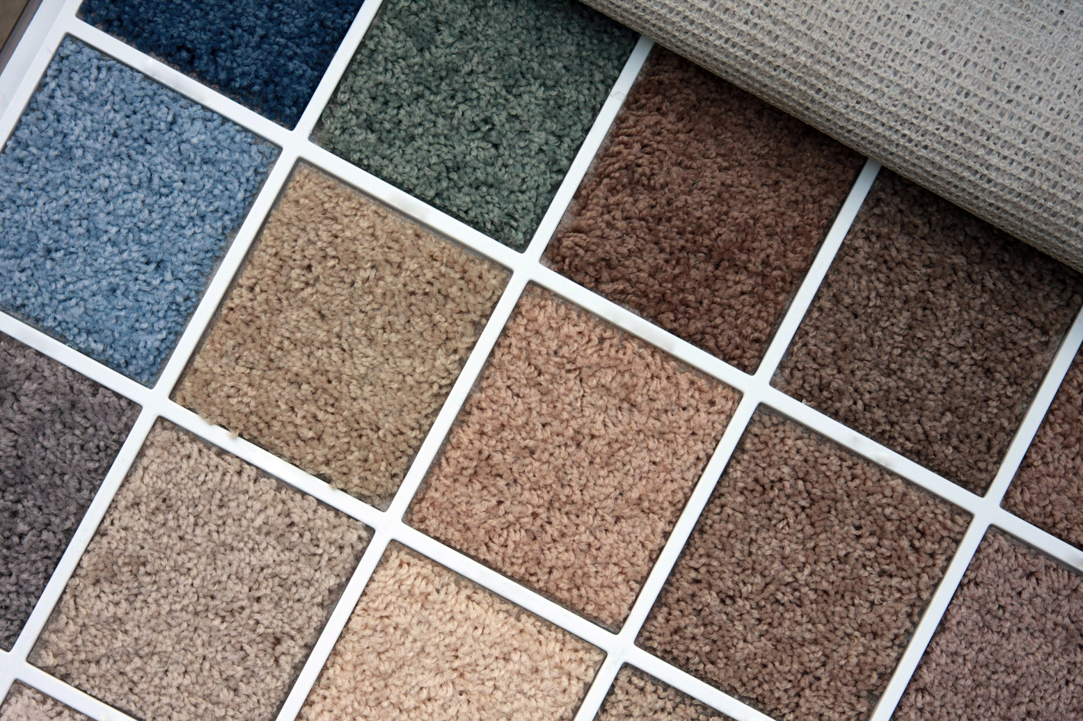 Sample book of different color carpets